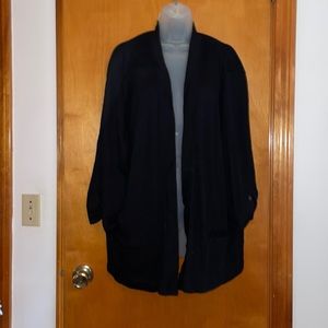 Open black jacket. Perfect for fall. Side front pockets. Cuffed button sleeves